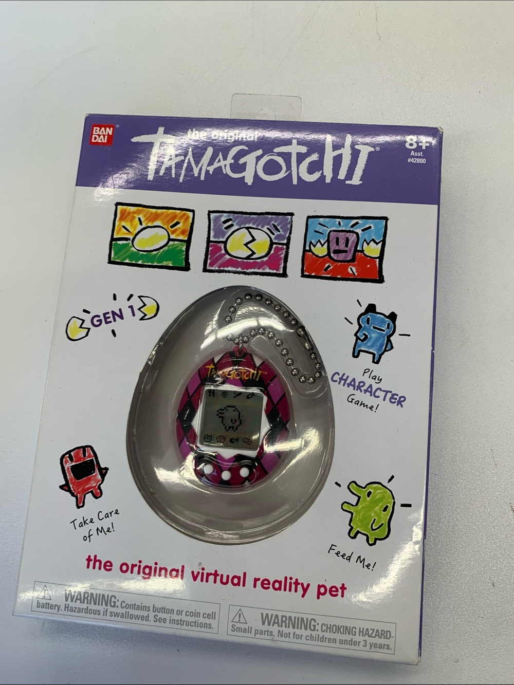 Bandai Tamagotchi Gen 1 Virtual Pet - Pink Patterned Egg